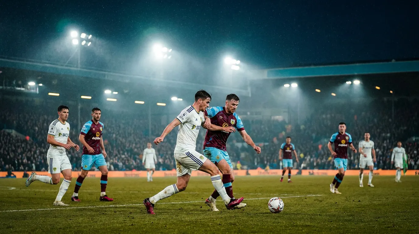 Estádio inglês lotado à noite com dois escudos estilizados — Leeds e Burnley — no duelo do Championship 2025/26